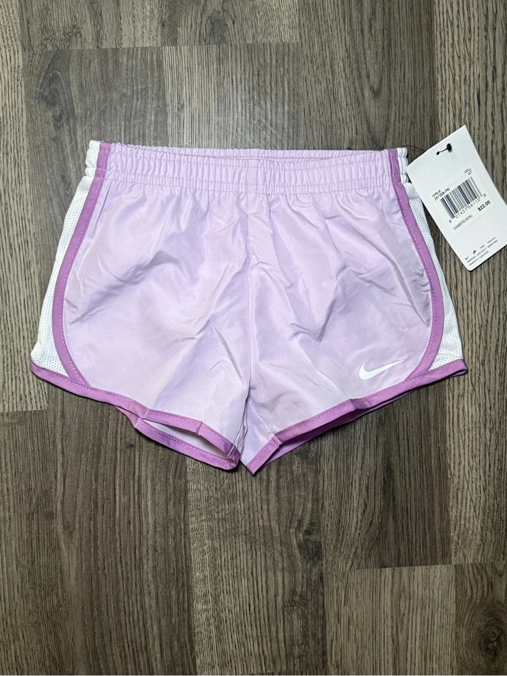 Nike Light Pink Women's Athletic Running Shorts with White Swoosh